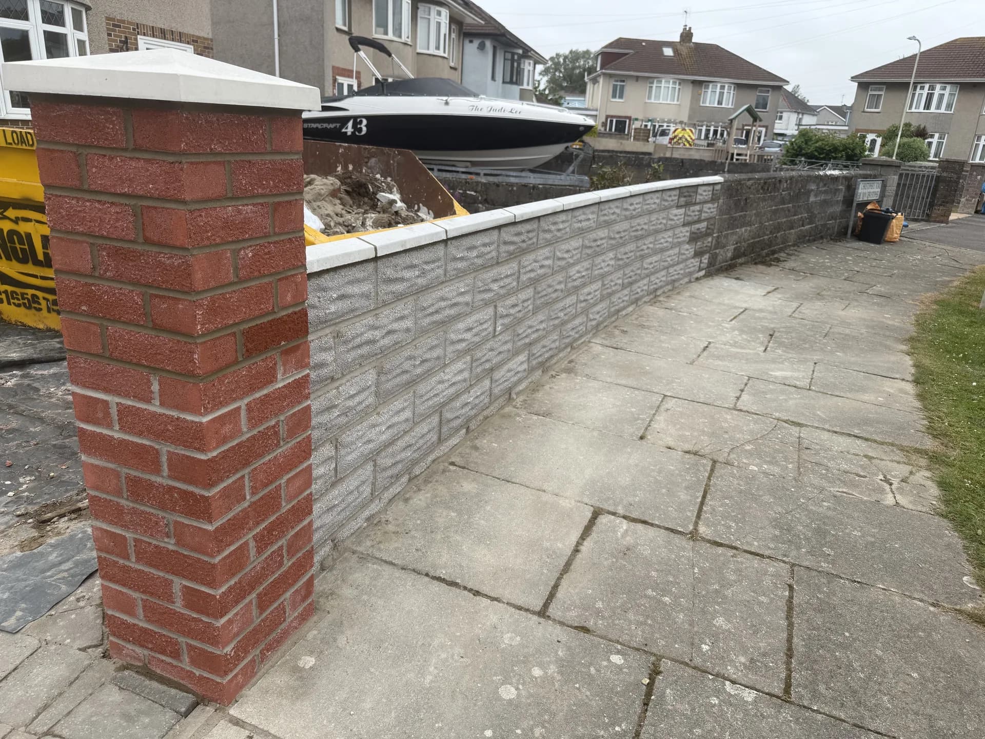 Brick boundary wall with pier and coping stones by Reynolds Brickwork in Cardiff