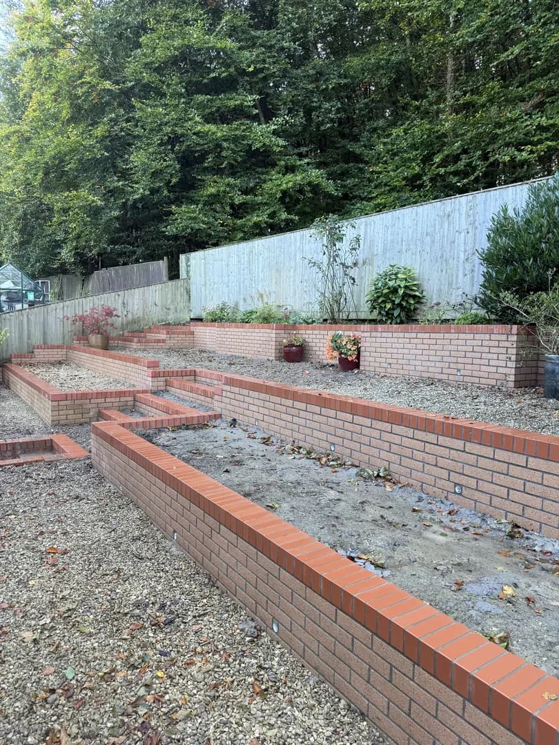 Brick garden wall with pillars and steps by Reynolds Brickwork in Porthcawl