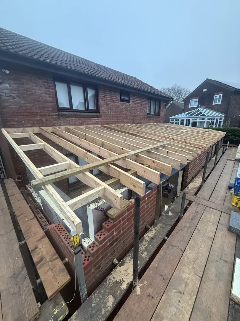 Double-storey brick extension with timber frame by Reynolds Brickwork in Bridgend