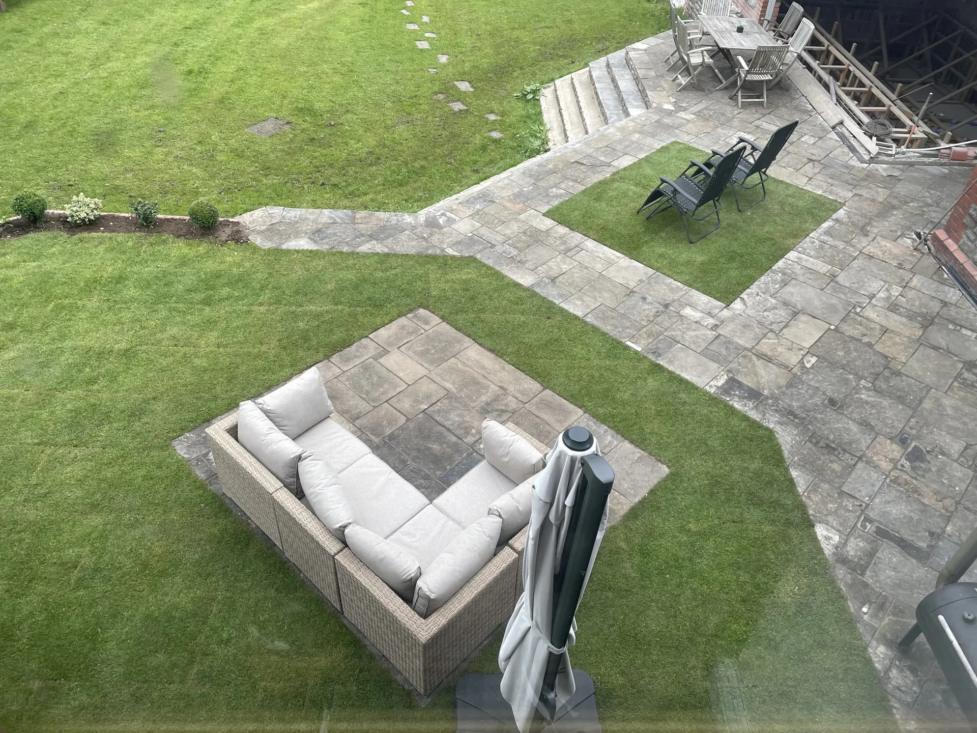 Garden landscaping with patio and outdoor living space by Reynolds Brickwork in Bridgend