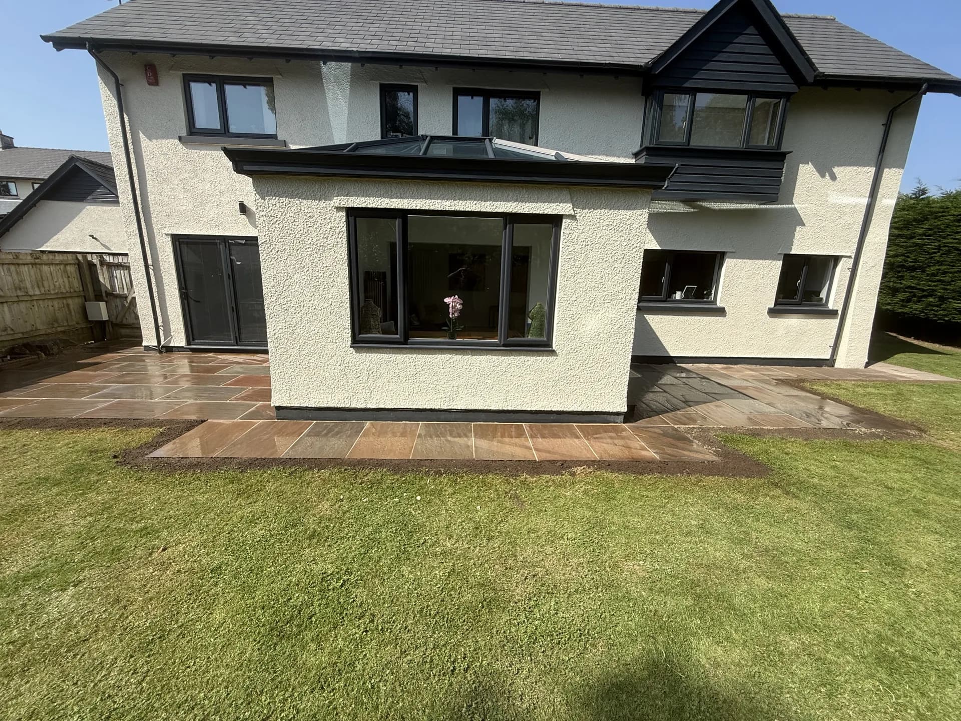 House extension with skylight and patio by Reynolds Brickwork in Bridgend