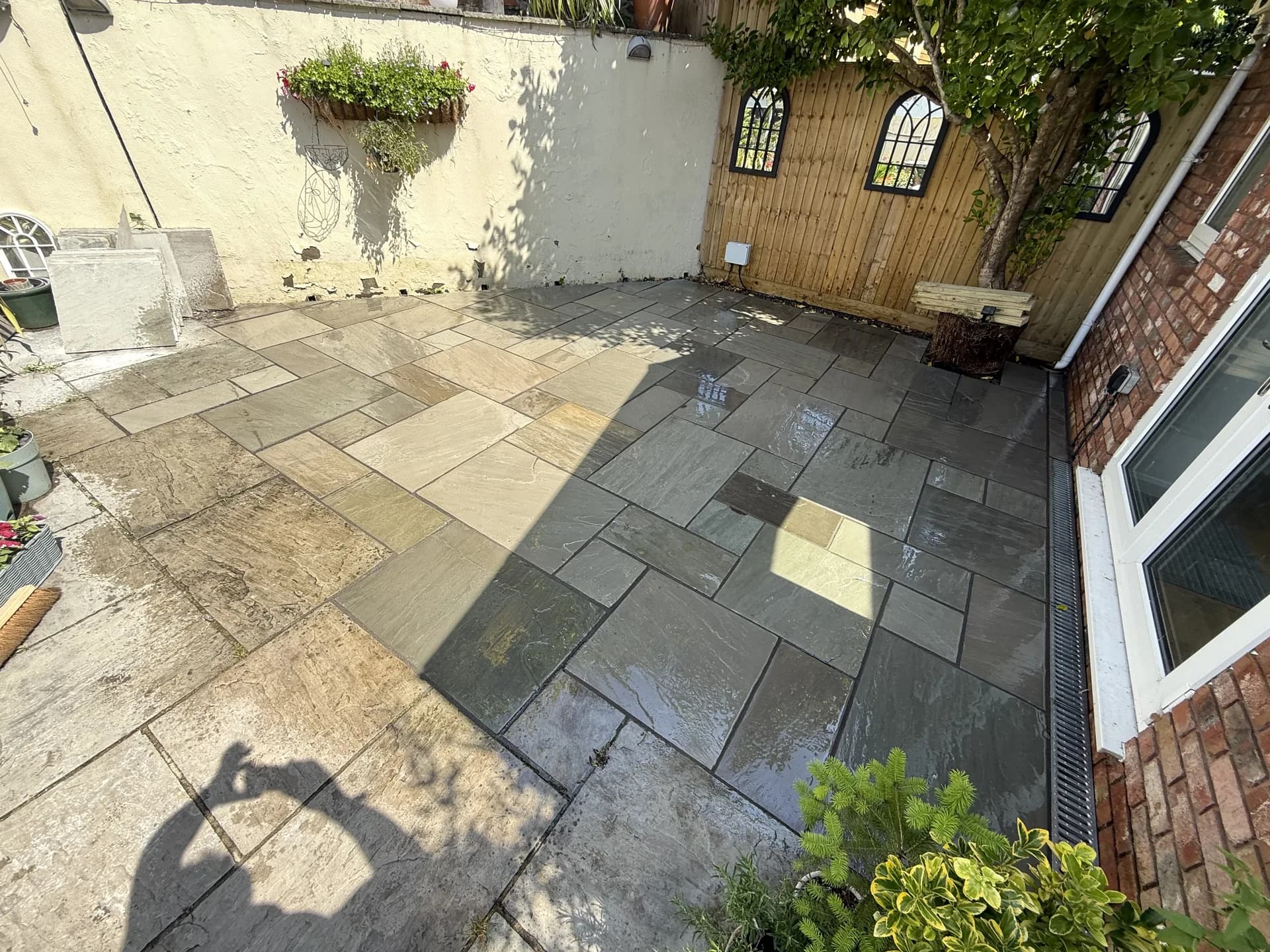 Natural stone patio garden transformation by Reynolds Brickwork in Porthcawl